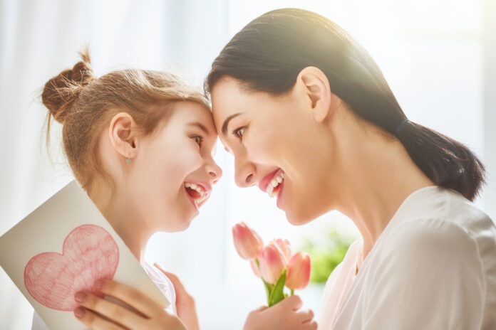 Happy,Mother's,Day!,Child,Daughter,Congratulates,Mom,And,Gives,Her